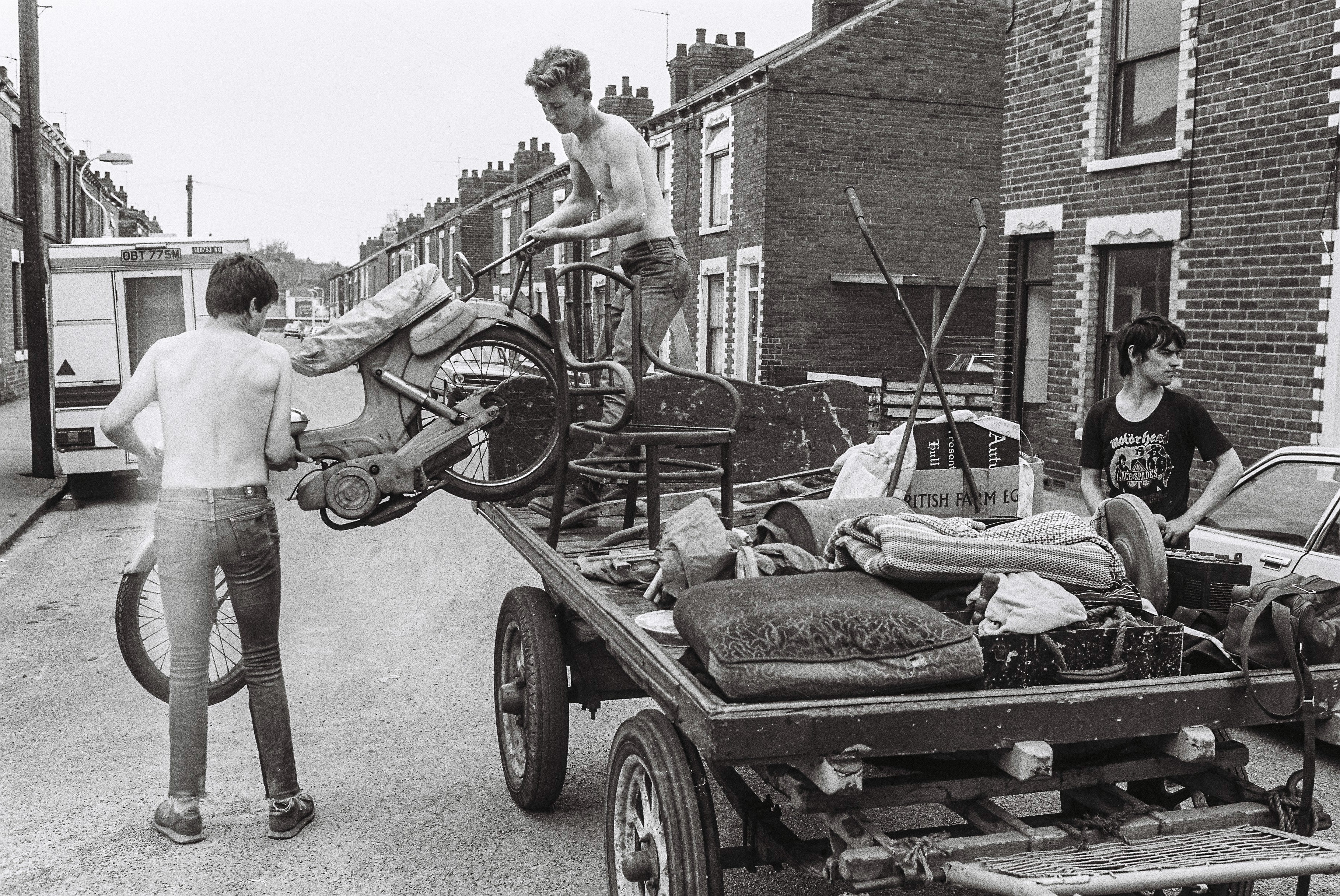 George Norris Jnr and Glen Collins loading a motorcycle onto a rulley in Stepney Lane, off Beverley Road, Hull.