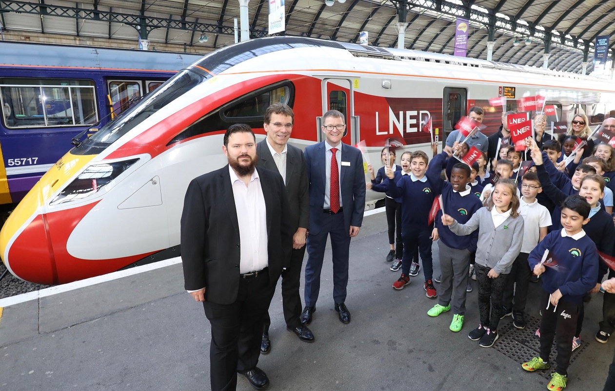 Garry Taylor, Hull City Council's city nanager for major projects and infrastructure, Cllr Daren Hale and LNER managing director David Horne with students and teachers from Pearson Primary, at the Azuma launch.