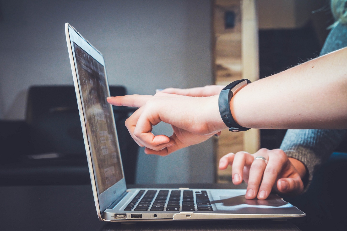 A person using a laptop.