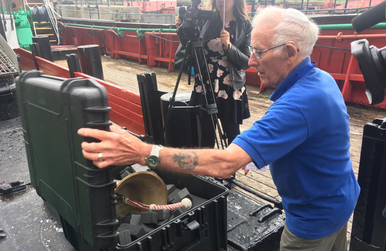 The Arctic Corsair's bell is carefully packed away by volunteer Trevor Evans.